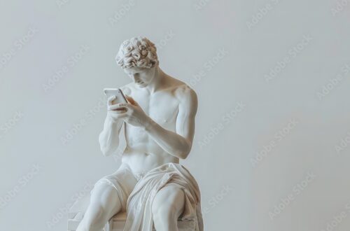 A white marble sculpture of a man sitting and looking at a smartphone.