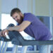 Why training doesn’t work. Tired exhausted young man feeling bad, unhealthy, unwell during run on treadmill in the gym